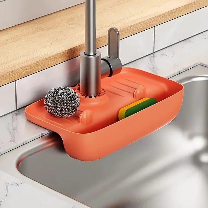 Silicone sink splash guard tray behind tap